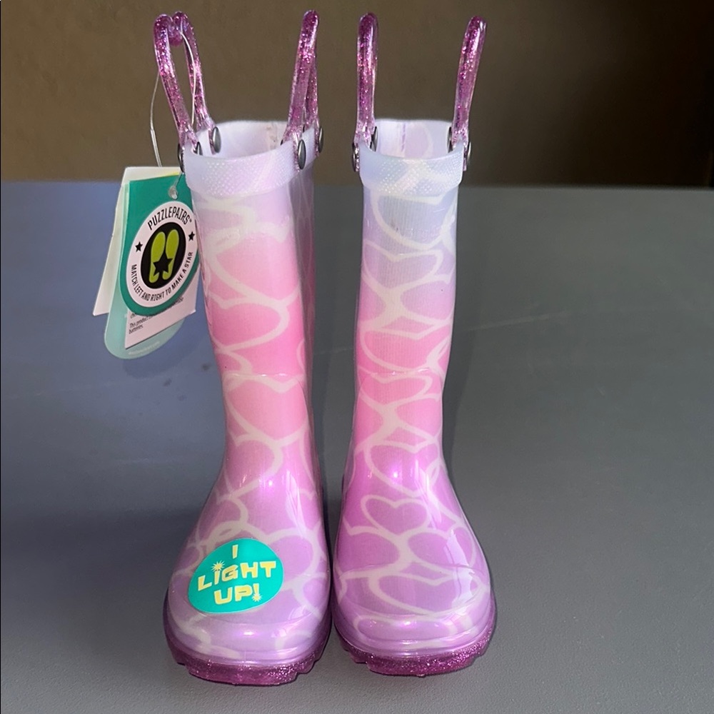 2 pairs of boots

Western Chief rain boots and Cat & Jack boots